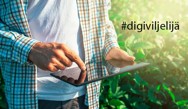 Henkilö käyttää tablettia. Kuvassa teksti #digviljelijä.